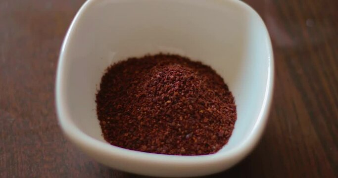 making sumac onion salad, parsley is chopped, onion, parsley, sumac and salt are mixed