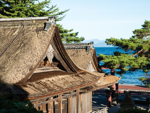 Takashima, Japan - August 22, 2018: Thatched rooftops of Shirahige shrine in the evening