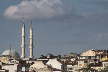 Fototapeta na wymiar Istanbul city panorama with low rise buildings and mosque minaret, cloudy summer day