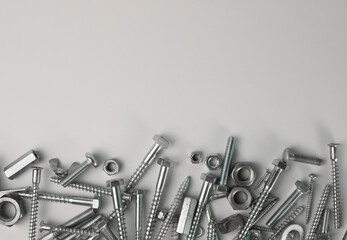 tools. on a light background, construction and fasteners, bolts, nuts and more. for advertising banners of construction label stores and more