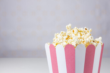 Close-up of popcorn inside a striped bowl.