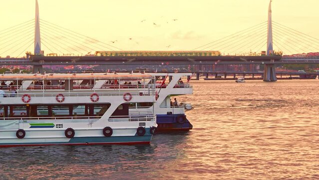 sunset bosphorus bridge bosphorus sea trams ferries Istanbul. Travel to Turkey. View from Galata bridge