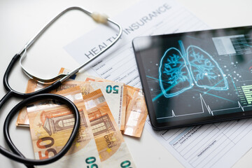 Paper with text Health insurance on the table with stethoscope