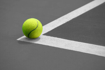 Tennis  ball on the blue-coated cour