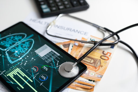 Paper with text Health insurance on the table with stethoscope