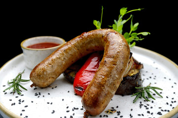 Grilled Sausages, Veggies, and BBQ Sauce on a Plate