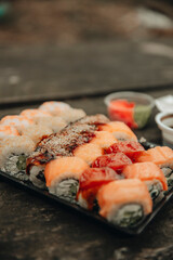 Sushi. Macro set of fresh Philadelphia sushi from fish, salmon, rice, cucumbers. Sushi restaurant, sushi delivery. Selective focus