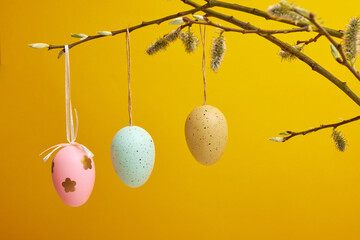 multi-colored easter eggs on a yellow background, easter holiday