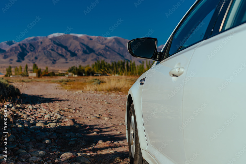 Sticker Car in the mountains at autumn, close-up