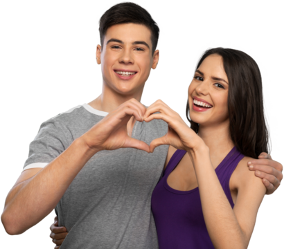 Portrait of smiling heterosexual young couple with heart shape