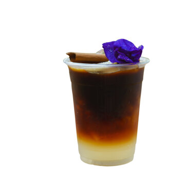 Ice americano lemon coffee fresh drink for summer decorate with cinnamon and Butterfly pea in plastic glass Isolated.