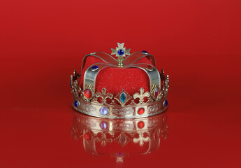 king crown isolated on red background