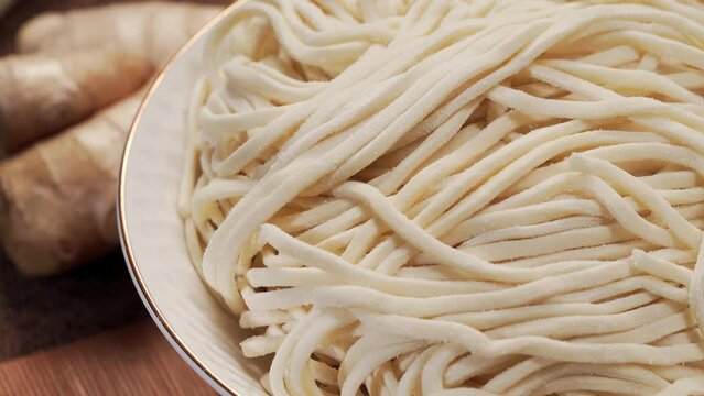 Fresh noodles against a simple background