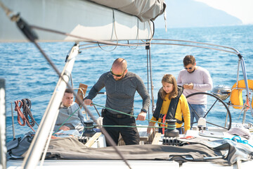 Voyage sail on sport sea luxury yacht. Yachting family summer vacation cruise. Children, sailor kid girl sailing in little safe life jacket. Ocean ship boa travel. Enjoy trip on sailboat front deck
