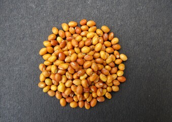 Pigeon pea seeds on black background 