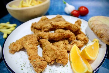 Deepfried chicken with french fries