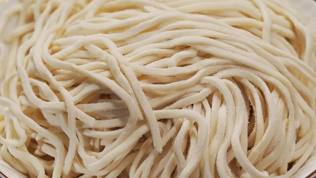 Fresh noodles against a simple background