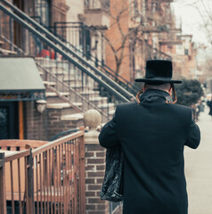 backside view of a jewish person with hat