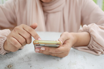 close up of women hand holding smart phone 