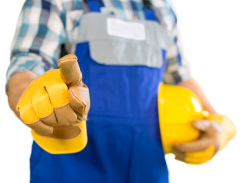 Worker man with helmet pointing at you on background