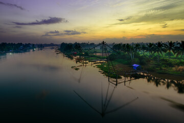 Beautiful sunrise view from Kadamakkudy landscape backwater, Kerala.