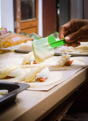 person preparing food in kitchen
