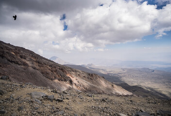 Rocky slope made of stones on Mount Ararat on a sunny summer day with clouds, slopes with scree