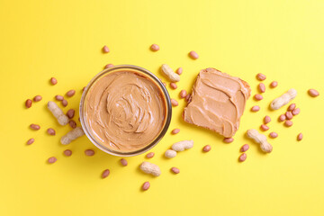 peanut butter and raw peanuts on a colored background