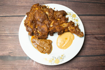 Chicken chop or chap with mayo dip served in dish isolated on wooden table top view indian spices food