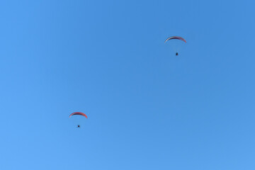 Paragliding in the blue sky