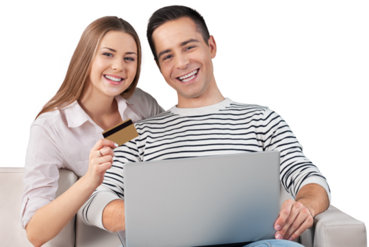 Smiling Couple Using a Laptop and Holding a Credit Card