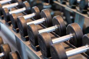 Dumbbells on weight rack in workout room
