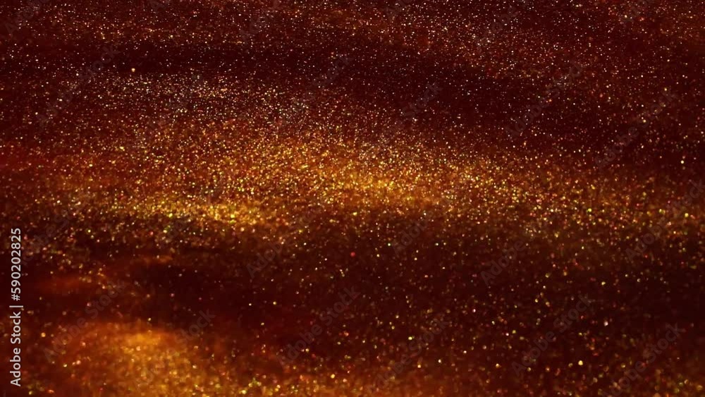 Wall mural floating golden dust particles in red fluid. the flow and disintegration of gold particles in a red 