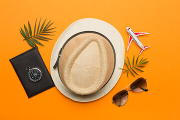 Traveler accessories on color background, top view