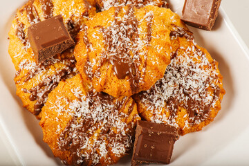 Fresh-baked Snickerdoodle cookies with chocolate and shredded coconut.