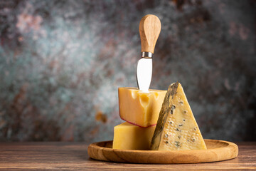 Board of different cheeses on the table.