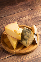 Board of different cheeses on the table.