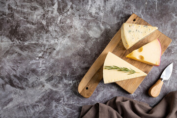 Various types of cheeses on the table.