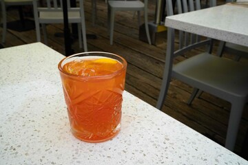 delicious looking old fashioned cocktail at an outdoor restaurant or bar