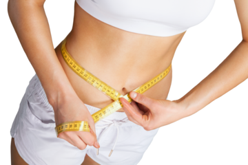 Slim young woman measuring her thin waist with a tape measure, close up