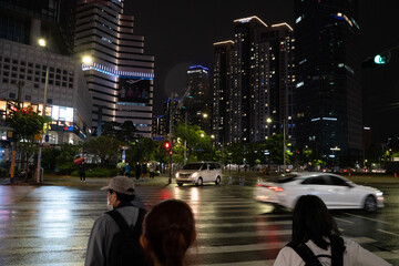 people walking on the street at night