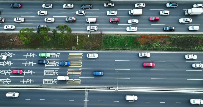 High angle view of Chinese capital construction that many cars passing through busy main roads in morning. Close-up photo of heavy traffic in daily working hours.
