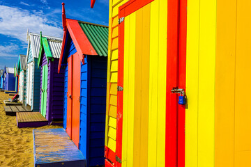 Colored beach huts or beach cabins in Melbourne Beach. They are a small, usually wooden and often brightly colored, box above the high tide mark on popular bathing beaches. Australia, 2017