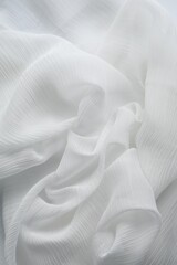 Beautiful white tulle fabric as background, top view