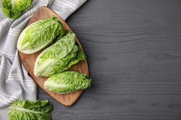 Fresh green romaine lettuces on grey wooden table, flat lay. Space for text