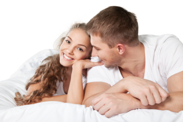 Portrait of young couple in bed