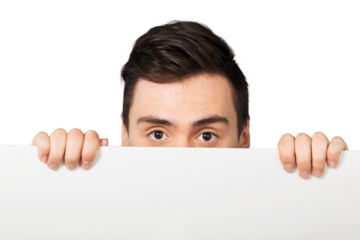 young man holding a blank empty banner over his face