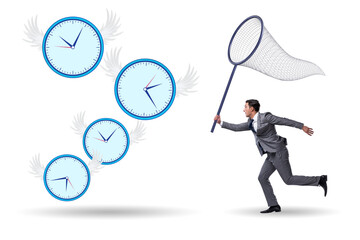 Deadline concept with businessman catching clocks