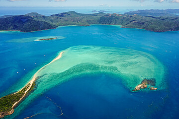 Aerial view of part of the Great Barrier Reef, the world's largest coral reef system composed of...