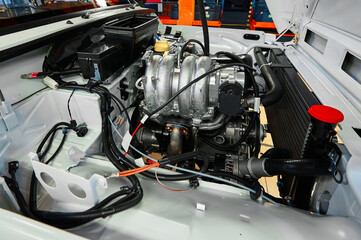 Open car compartment with different details in workshop